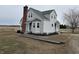 Charming two-story home with a brick chimney and a landscaped yard at 220 Huffman Rd, Columbus, IN 47201