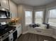 Cozy kitchen nook with a window seat, and views of the back yard at 220 Huffman Rd, Columbus, IN 47201