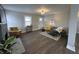 Inviting living room with stylish furnishings, wood floors, and natural light at 220 Huffman Rd, Columbus, IN 47201