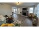 Inviting living room featuring wood floors, a fireplace, and natural light at 220 Huffman Rd, Columbus, IN 47201