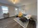 Inviting living room with stylish furnishings, wood floors, and lots of natural light at 220 Huffman Rd, Columbus, IN 47201