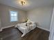 Bedroom with neutral tones, hardwood floors, and plenty of natural light at 220 Huffman Rd, Columbus, IN 47201