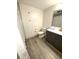 Bathroom with hardwood floors featuring toilet, vanity, and shower with curtain rod at 2284 Horizon Blvd, Greenwood, IN 46143