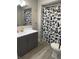 Bathroom featuring a stylish vanity, modern sink, and shower with a patterned curtain at 2284 Horizon Blvd, Greenwood, IN 46143