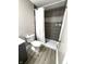 Updated bathroom with a shower featuring dark gray tiles, modern fixtures, and stylish accents at 2284 Horizon Blvd, Greenwood, IN 46143