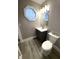 Charming bathroom with a unique octagonal window, modern vanity, and updated fixtures at 2284 Horizon Blvd, Greenwood, IN 46143