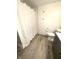 Bathroom with hardwood floors featuring toilet, vanity, and shower with curtain rod at 2284 Horizon Blvd, Greenwood, IN 46143