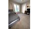 Inviting bedroom featuring neutral carpet, a twin bed, and a backyard view at 2284 Horizon Blvd, Greenwood, IN 46143
