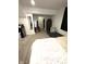 Bedroom featuring carpeted floors, area rug, dresser, fan, and platform bed at 2284 Horizon Blvd, Greenwood, IN 46143