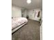 Bedroom featuring carpeted floors, full-length mirror, and white furniture at 2284 Horizon Blvd, Greenwood, IN 46143