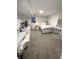 Bedroom featuring carpeted floors, TV, full-length mirror, and white furniture at 2284 Horizon Blvd, Greenwood, IN 46143