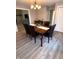 Open dining room with a table and chairs, leading to a living area and hallway at 2284 Horizon Blvd, Greenwood, IN 46143