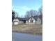 Charming home with a stone and tudor facade, attached garage and green front lawn at 2284 Horizon Blvd, Greenwood, IN 46143