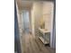 Hallway with wood-look floors and white trim, leading to various rooms at 2284 Horizon Blvd, Greenwood, IN 46143