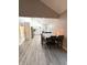 Open-concept kitchen with white cabinets, stainless steel appliances, and light wood floors at 2284 Horizon Blvd, Greenwood, IN 46143