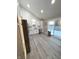 Bright kitchen with white cabinets, stainless steel appliances, and sliding glass door leading to the backyard at 2284 Horizon Blvd, Greenwood, IN 46143