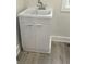 Close up of a laundry sink with a silver faucet and a white cabinet beneath at 2284 Horizon Blvd, Greenwood, IN 46143