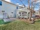 Charming backyard featuring a pergola-covered deck, a stone patio, and a grassy area at 2311 Lammermoor Ln, Indianapolis, IN 46214