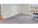 Bedroom featuring a closet, gray carpet, neutral walls, and a lamp on a table at 2311 Lammermoor Ln, Indianapolis, IN 46214