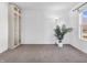 Bright bedroom features a large window, neutral walls, and comfortable carpeting at 2311 Lammermoor Ln, Indianapolis, IN 46214