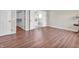 Bedroom with wood-look floors and access to a walk-in closet and bathroom at 2311 Lammermoor Ln, Indianapolis, IN 46214