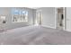 Bedroom featuring neutral carpet, a window offering natural light, and an en-suite bathroom at 2311 Lammermoor Ln, Indianapolis, IN 46214