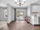 Bright dining area with a view of the outdoor deck, stylish lighting and convenient access to the kitchen at 2311 Lammermoor Ln, Indianapolis, IN 46214