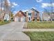 Beautiful two-story home with a well-maintained front yard and a two-car garage at 2311 Lammermoor Ln, Indianapolis, IN 46214