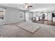 Bright and airy living room with large windows and an open view of the kitchen at 2311 Lammermoor Ln, Indianapolis, IN 46214