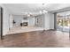 Spacious living room featuring hardwood floors, a fireplace, and sliding glass doors to the deck at 2311 Lammermoor Ln, Indianapolis, IN 46214