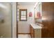 Bathroom features wood vanity, mirror, and walk in shower at 234 S East St, Pendleton, IN 46064