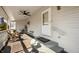 Covered porch with ceiling fan, seating area, and entryway to home at 234 S East St, Pendleton, IN 46064