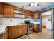 Traditional kitchen featuring wooden cabinets, white countertops, and stainless steel appliances at 234 S East St, Pendleton, IN 46064