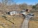 Aerial view of a home with an outbuilding, private drive and lots of parking at 24535 Jerkwater Rd, Sheridan, IN 46069