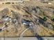 Aerial view showcasing a home with a long driveway and some outbuildings at 24535 Jerkwater Rd, Sheridan, IN 46069