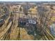 A stunning aerial view highlights the backyard's gazebo, patio, mature trees, and surrounding yard at 24535 Jerkwater Rd, Sheridan, IN 46069