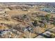 Aerial view highlights the location with homes among the mature trees, fields, a school, and private driveways at 24535 Jerkwater Rd, Sheridan, IN 46069