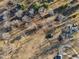 Birds eye view of multiple houses with mature trees, long shadows, and private driveways at 24535 Jerkwater Rd, Sheridan, IN 46069