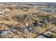 Overhead view features a home with mature trees, a private driveway, fields, and a marker at 24535 Jerkwater Rd, Sheridan, IN 46069