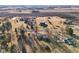 A beautiful rural community featuring mature trees, large yards, and long driveways, all under a bright blue sky at 24535 Jerkwater Rd, Sheridan, IN 46069