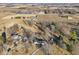 A clear aerial shot showcases several homes surrounded by fields, mature trees, and private driveways at 24535 Jerkwater Rd, Sheridan, IN 46069