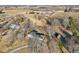An aerial view showcases the home's setting among the trees, outbuildings, and driveway at 24535 Jerkwater Rd, Sheridan, IN 46069