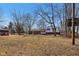 Expansive backyard view showcasing the home's outdoor space, including a gazebo and outbuildings at 24535 Jerkwater Rd, Sheridan, IN 46069