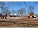 Expansive backyard featuring a play set, outbuildings, and plenty of space for outdoor activities at 24535 Jerkwater Rd, Sheridan, IN 46069