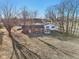 Aerial view of the backyard featuring a quaint gazebo, patio, and a mature tree at 24535 Jerkwater Rd, Sheridan, IN 46069