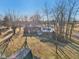 Aerial view showcases the backyard with a gazebo, patio, mature trees, and exterior home features at 24535 Jerkwater Rd, Sheridan, IN 46069