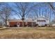 Large backyard featuring a brick house with an attached gazebo, creating an inviting outdoor space at 24535 Jerkwater Rd, Sheridan, IN 46069