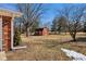 View of a red barn with white trim, set on a large open lot with mature trees at 24535 Jerkwater Rd, Sheridan, IN 46069