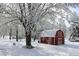 Red barn surrounded by trees and a light snow covered ground at 24535 Jerkwater Rd, Sheridan, IN 46069