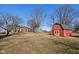Picturesque red barn on a sprawling property with charming farmhouse in the background at 24535 Jerkwater Rd, Sheridan, IN 46069